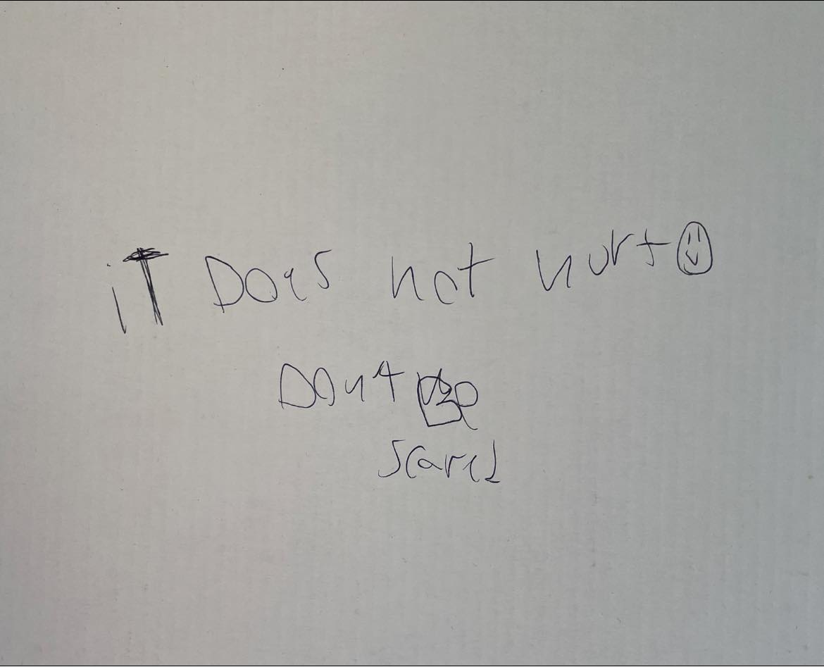 In the vaccination booth this morning and kids had earlier been allowed to write on the wall. This was in my eyeline when I turned away to avoid seeing the needle.