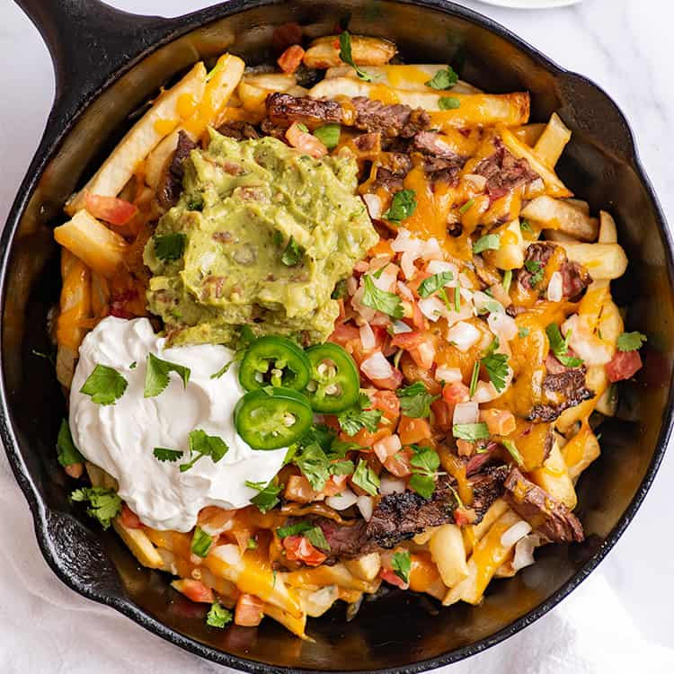 TedBey's tweet photo. Poutine and Carne Asada fries are cousins if not brothers. #NAFTA #Quebexico https://t.co/ZC2LX9UBjD