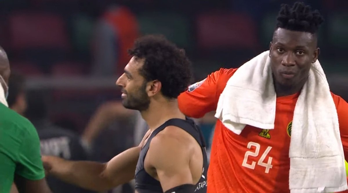 Salah comforts the Cameroon players before celebrating reaching the final. 🤝