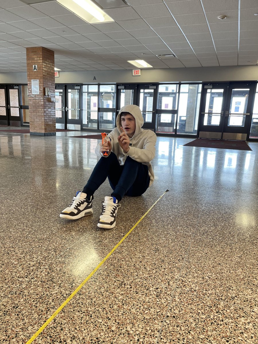 MasonCityCSD's tweet photo. @MCHS_MCCSD Physics II class took their classroom to the commons this morning to conduct an experiment with Nerf guns to determine the launch velocity of a Nerf dart. https://t.co/yKdON4j82T