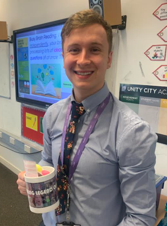 Lift_Unity_City's tweet photo. Congratulations to Mr Spencer, our Maths ECT, this week's TEACHING LEGEND! This is for contributing to our praise culture by writing such motivational feedback in class books and making positive calls home.💜#TeamUCA #findyourremarkable #OneAET https://t.co/CMRG2qc1Y9
