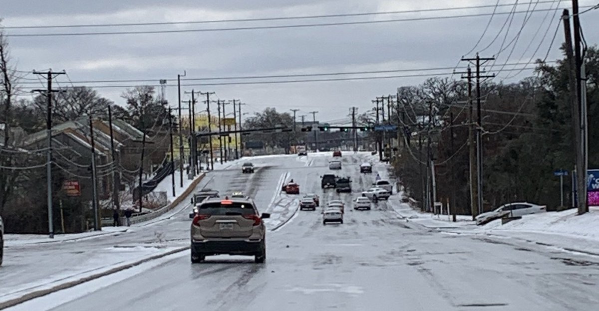 ArlingtonPD's tweet photo. This is what we mean, folks!

This photo was snapped a short time ago along Cooper near Inwood. All those you cars you see became disabled trying to get up that incline. 

The roads are still very slick — so if you don’t have to be on them, please stay home! #ArlingtonTX https://t.co/TK1227VTOM
