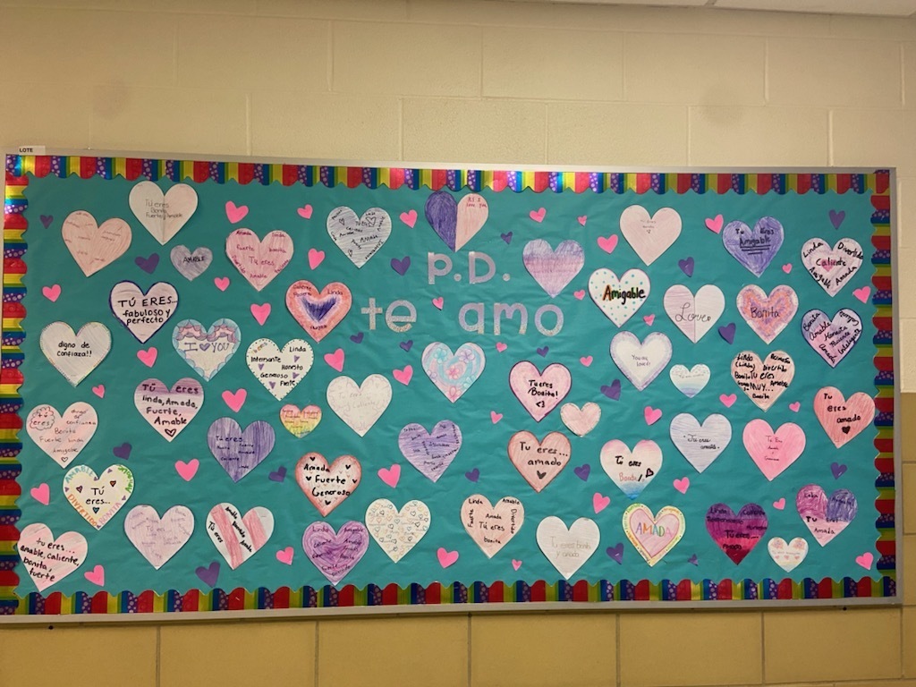 ¡P.D. TE AMO!💜 Our Spanish bulletin board in celebration of PS. I love you day. All positive adjectives in Spanish to send their peers positive messages as they walk by.