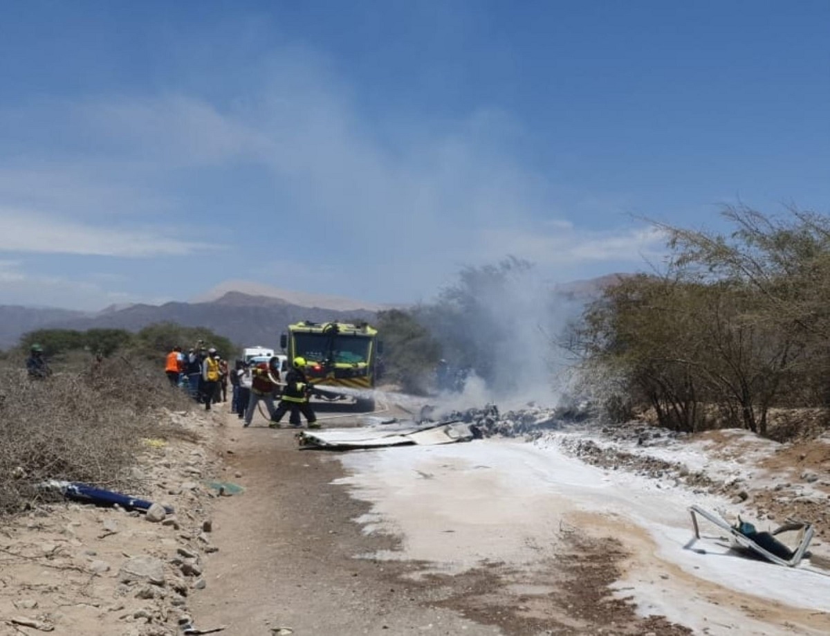 Emergency responders at the wreckage site of a small tourist aircraft near the Nazca Lines in Peru.