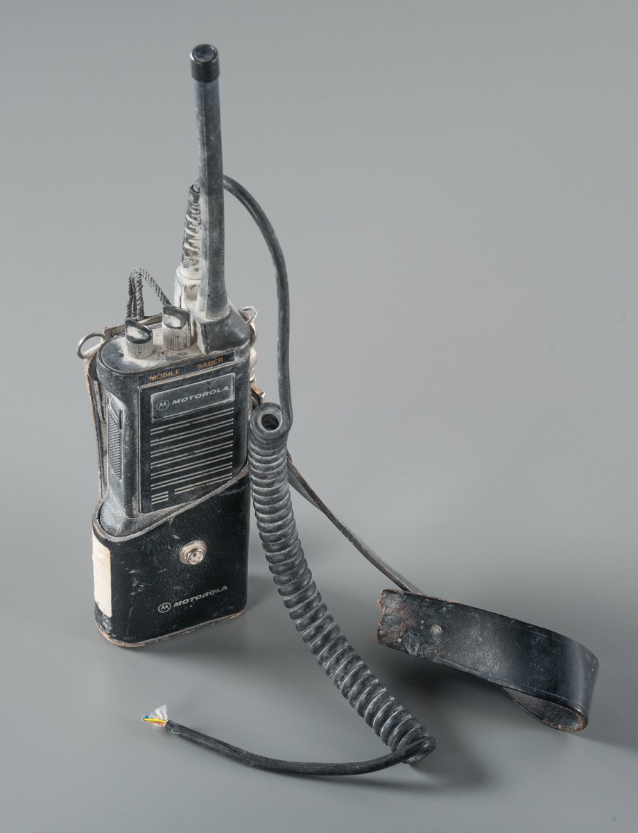 From the Collection: Recovered handheld radio/walkie-talkie used by <a href="/FDNY/">FDNY</a> Chief Peter James Ganci, Jr. Chief Ganci lived on Long Island, with his wife, Kathleen. They had raised three children. On 9/11, he directed the FDNY response. He was last seen near the North Tower.