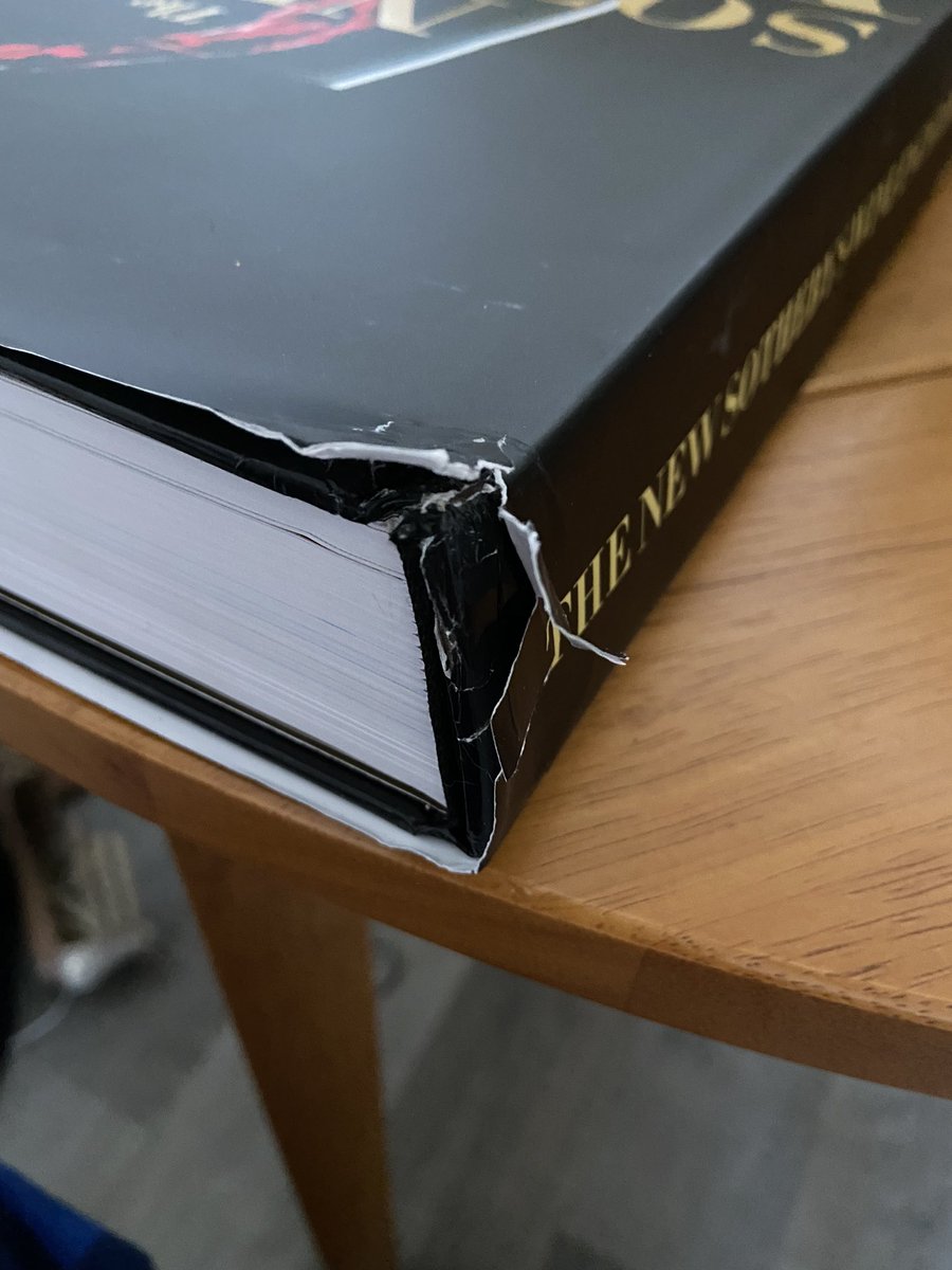 Mauk_One's tweet photo. @amazon really is just out delivering “brand new” $75 books like this with no protective packaging in the box https://t.co/Be2Ci64mU0