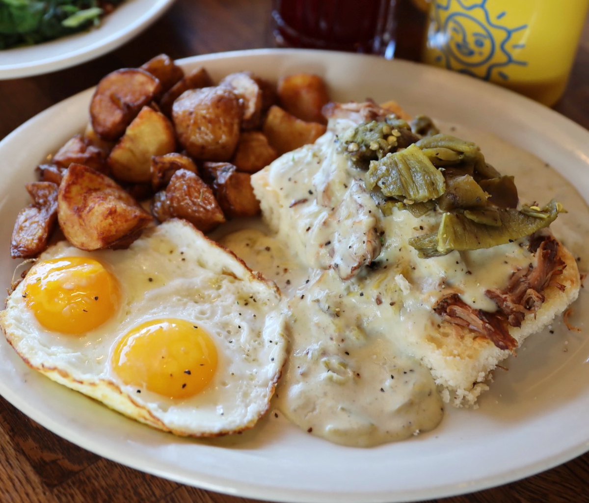 Can’t shake this chilly weather? Tuck into a plate of our Pork and Green Chili Biscuits and Gravy-
Open face Homemade biscuit loaded with slow roasted pork, green chili cream gravy, and SunnySide eggs. #itsalwayssundaymorning