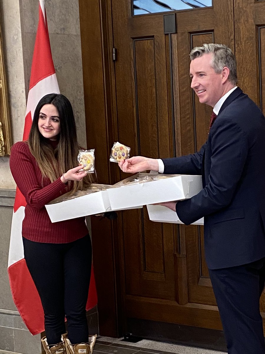 CPC MP Michael Barrett and LPC MP Emmanuella Lambroupoulos prepare to deliver cookies to MPs as an act of random kindness. Good day for it.