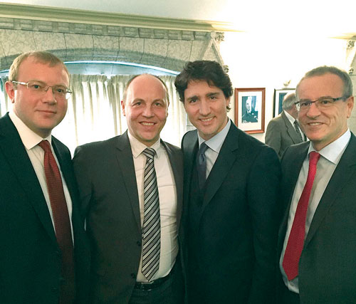 _ThePeoplesNews's tweet photo. As Trudeau stokes the fires and continues to divide Canadians by equating the trucker convoy and its  supporters as Neo-Nazis who "stand with swastikas", we wanted to show you a picture of Trudeau, smiling &amp; putting his hand around a literal neo-nazi from Ukraine, Andriy Parubiy. https://t.co/QuNVabSHYk