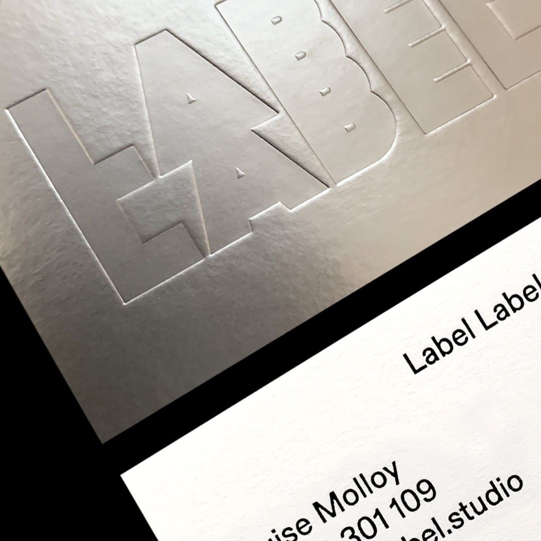 Peregrina Classics Metallic Silver duplexed with Munken Design Polar Rough for Label Label Studio's business cards. Designed by Both Studio the 650gsm cards feature a crisp blind debossed logo, printed by <a href="/JotPaperCo/">Jot Press</a>.