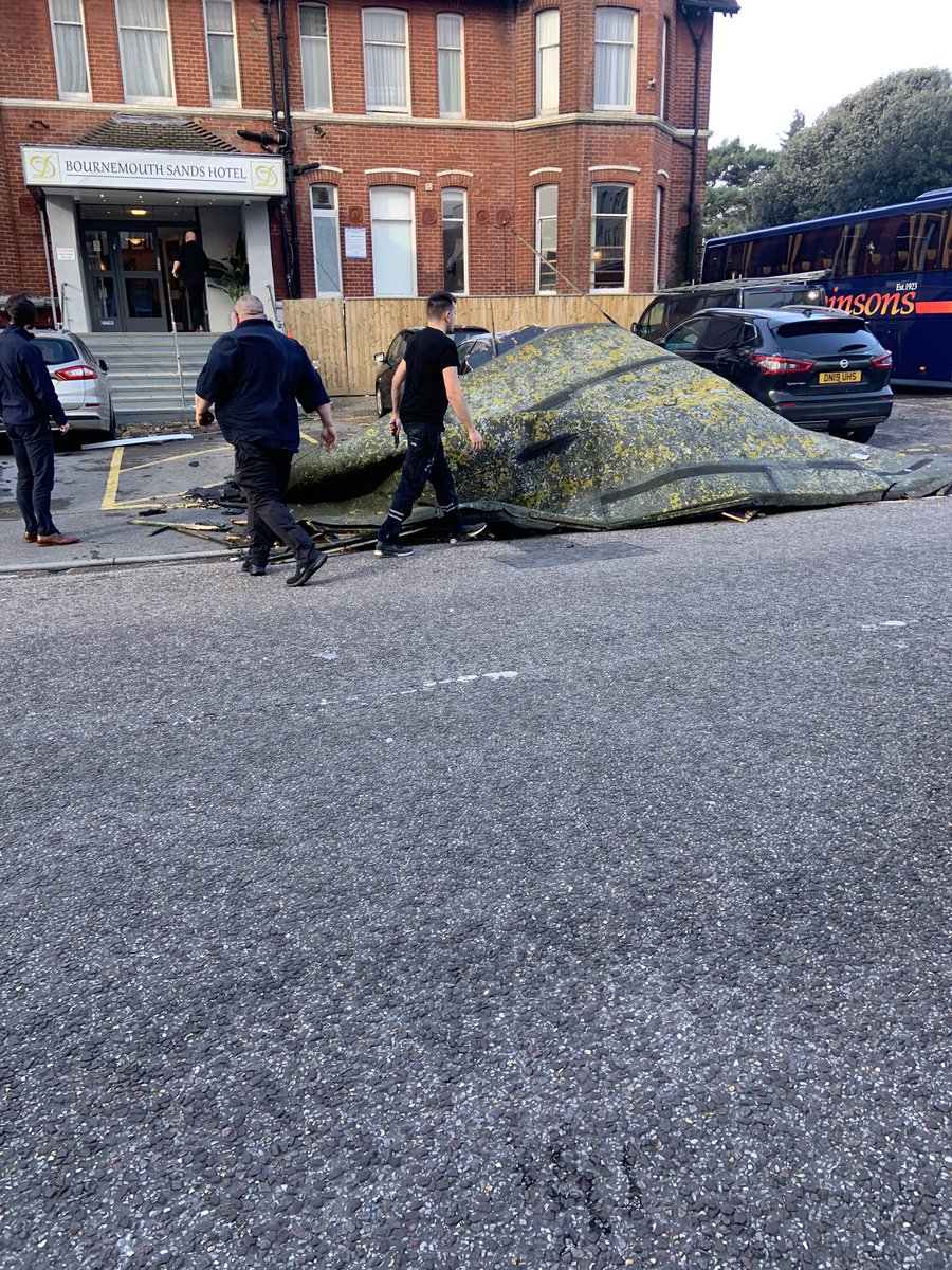 Elisadel7's tweet photo. Storm Eunis is in full swing here In Bournemouth. The Bournemouth Sands hotel roof has come apart and landed on a car! 😱 @loosewomen https://t.co/f9SNtPkpPM