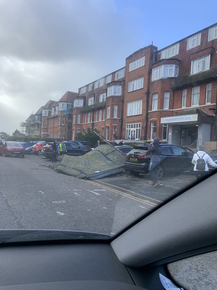 Elisadel7's tweet photo. Storm Eunis is in full swing here In Bournemouth. The Bournemouth Sands hotel roof has come apart and landed on a car! 😱 @loosewomen https://t.co/f9SNtPkpPM
