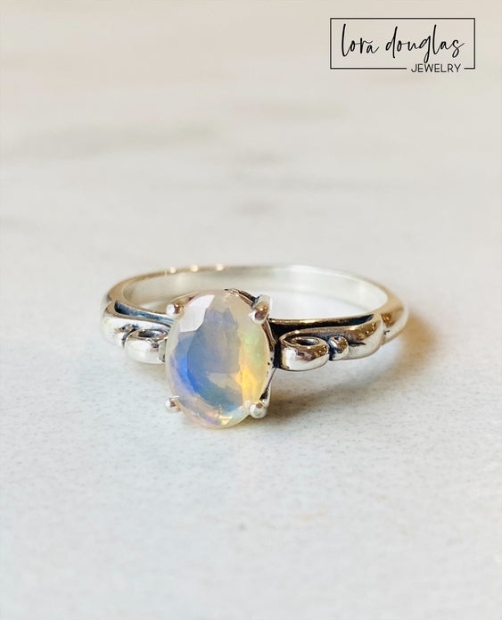 LoraDJewelry's tweet photo. Have you ever seen a Water Opal? They're known for their distinct milky coloring. This sterling scroll setting is probably one of my favorites. Opals are the birthstone for October.

#jewelrydesigner #jewelry #ring  #silver #fashionaccessories #opal #fashionjewelry https://t.co/55HyJMJqAW