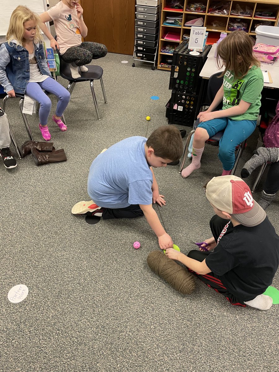 HESHixson's tweet photo. Who can putt the ball closest to the hole? We thought we could tell who was the closest by only using our eyes to measure. We soon found out that our eyes aren’t always accurate! Yarn helped us measure the distance so we could compare. https://t.co/HvwFzus10g