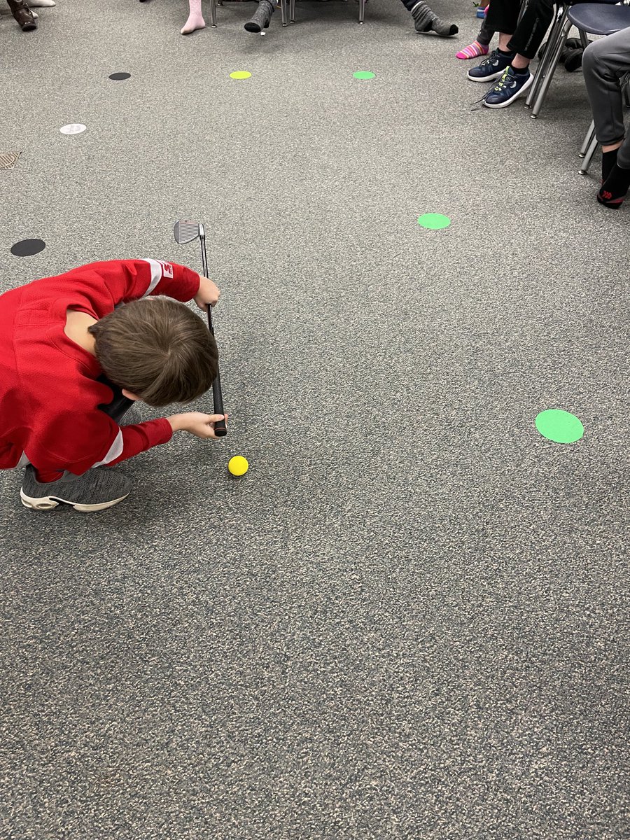 HESHixson's tweet photo. Who can putt the ball closest to the hole? We thought we could tell who was the closest by only using our eyes to measure. We soon found out that our eyes aren’t always accurate! Yarn helped us measure the distance so we could compare. https://t.co/HvwFzus10g