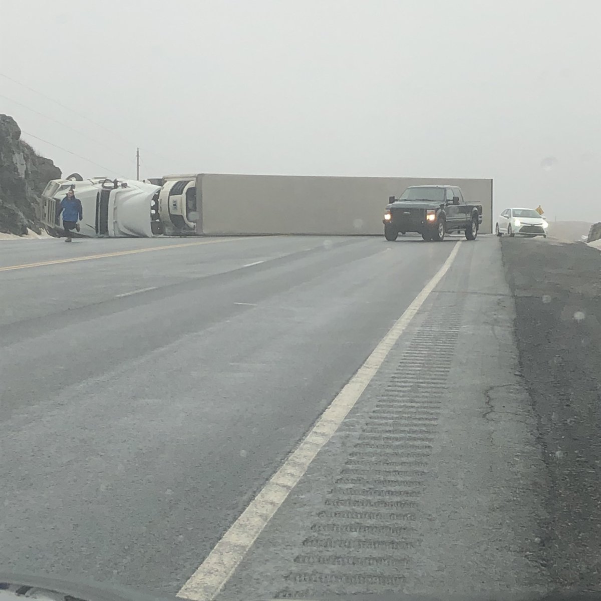 RadioGregSmith's tweet photo. Transport truck over turned on TCH around Chance Cove. Traffic is moving around it. #nltraffic @VOCMNEWS https://t.co/EXlJIItFqy