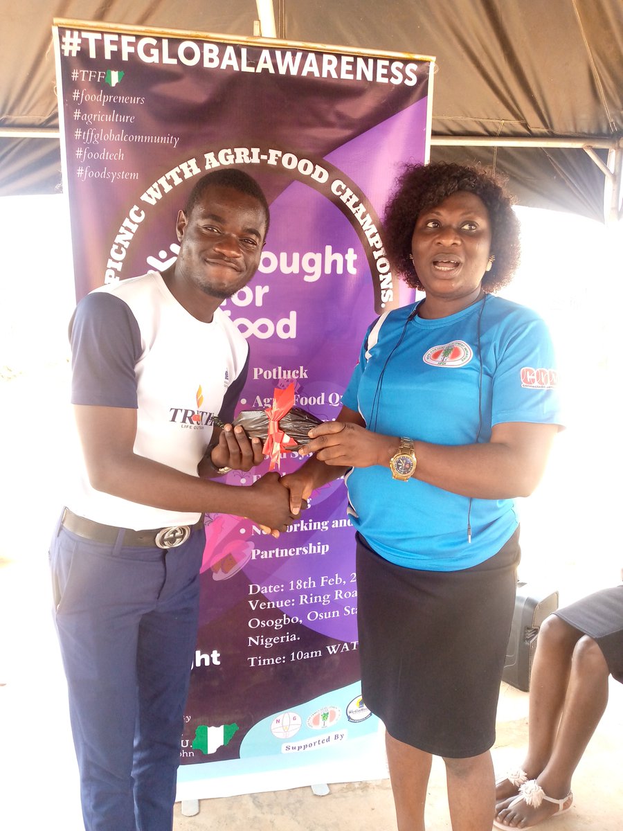 Director of Programs, SoLife Nigeria presenting prize to the winner of social networking game. #TFFGlobalAwarenessWeeks