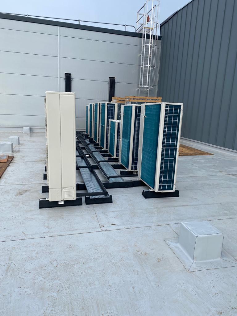 CampusMelksham's tweet photo. More progress on the Campus building with solar panels &amp; refrigeration units installed; tiling progressing nicely.   @Sport_England https://t.co/kDcXWxAoxk
