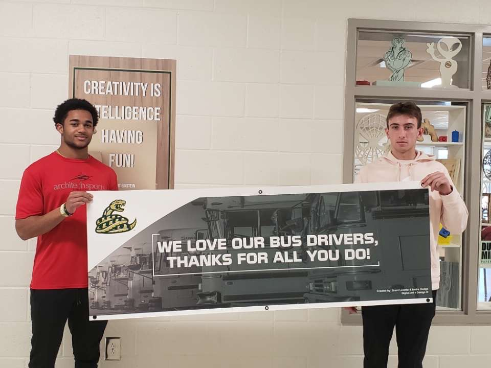 CRHS_DAAD's tweet photo. Happy bus driver appreciation week! CRHS celebrated the bus drive with some nice surprises, here’s Grant &amp; Andre with a banner they made to hang in the bus loop from CRHS! 🐍#bethewhy https://t.co/U4YGJ4yCeR