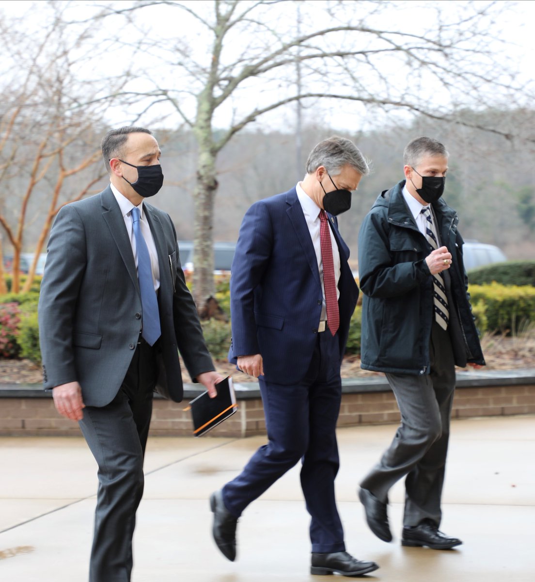 FBI Director Christopher Wray (center) walks with leaders from the Bureau's Operational Technology Division.