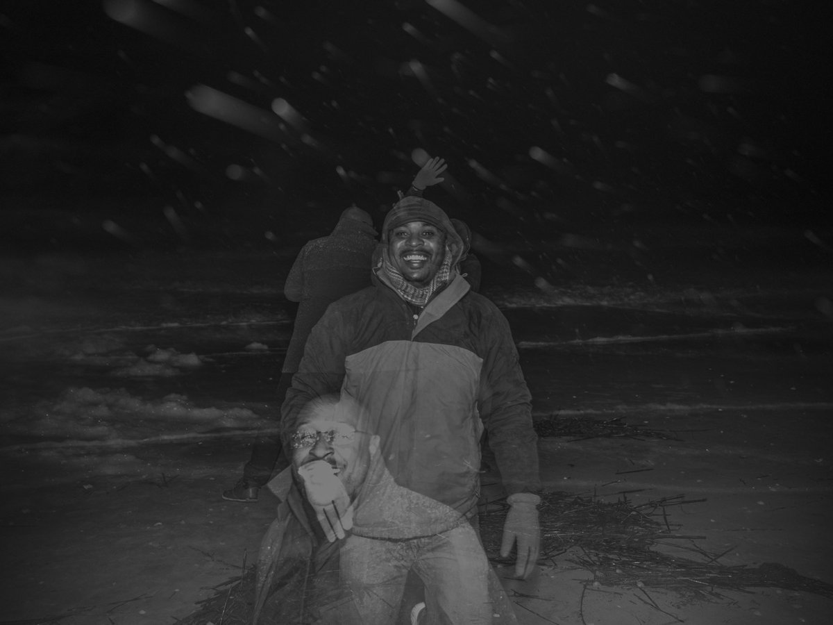 Triple-exposure beach snow-storm laughing slap-fight.