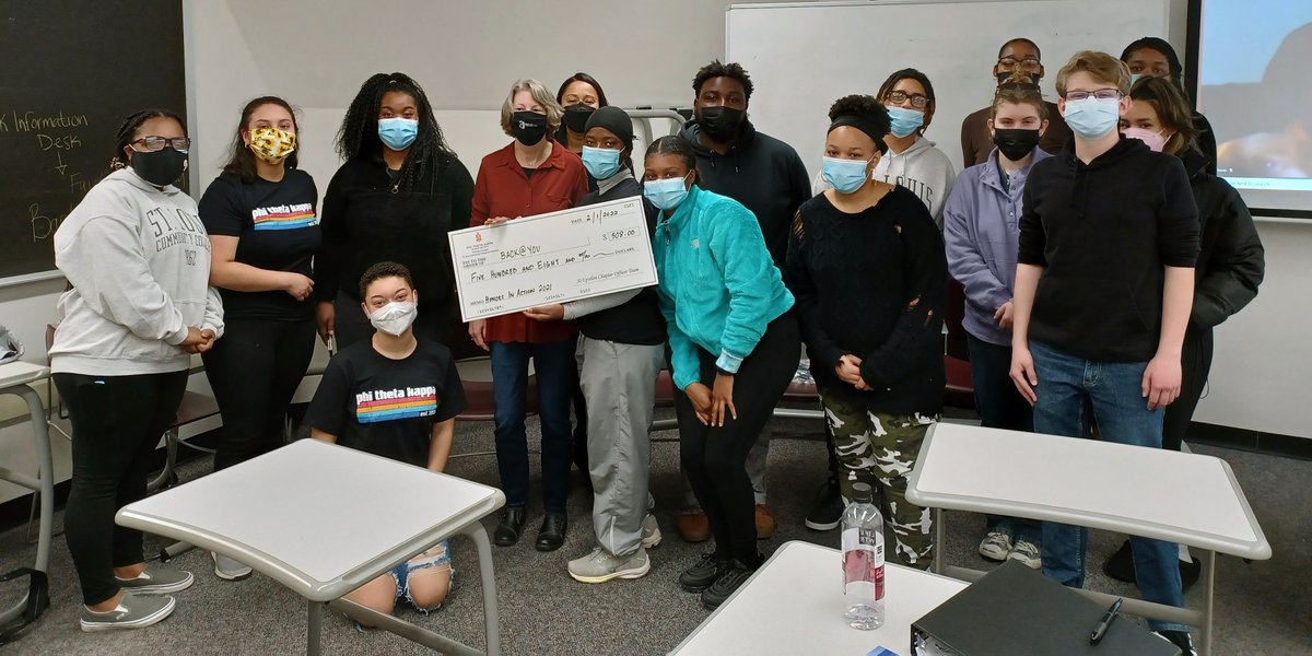 Kathy Acre, founder of @BACKatYOUStL, receives $508 from Xi Epsilon chapter of <a href="/PhiThetaKappa/">Phi Theta Kappa Honor Society</a>. XE decorated doors, sold candy during holidays to help Back@You, a non-profit that provides #unhoused people w/ backpacks filled w/ essential supplies. #STL #homeless #stlouis #caring