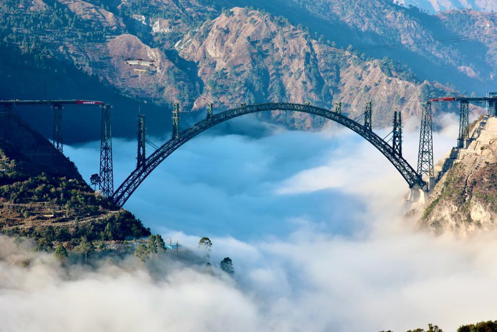 DrJitendraSingh's tweet photo. Splendid! 
The world's highest #arch #ChenabBridge in district #Reasi of #JammuAndKashmir. Standing above the clouds! https://t.co/FX9gvncXT0
