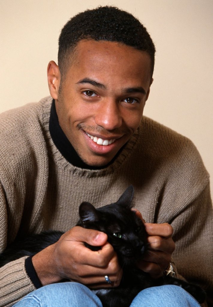 ThrowbackAFC's tweet photo. A young Thierry Henry with a cat, circa 1998 https://t.co/5ECjaCYHfN