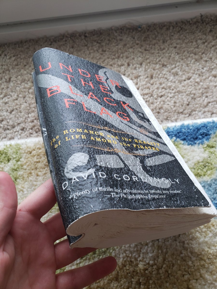 mothsloth's tweet photo. @DanielBGreene I'm gonna give you this here because I always miss these calls for pics. Behold, the most ironically fucked up but still technically readable book. Turns out bad salt lamps can leak salt into the air and this pirate history book was right by it so it looks like a sea barnacle. https://t.co/YKaAupjqdE