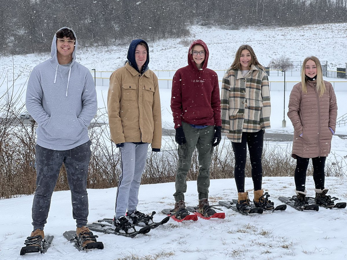 Today we hiked through the football field, up the hill and behind the press box! We have some expert snowshoers!!