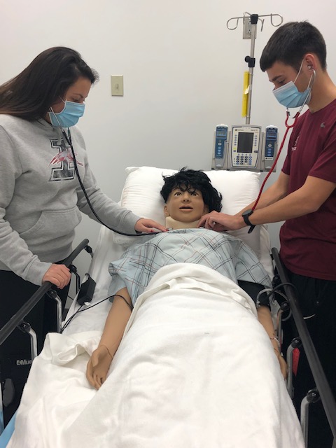 UIndyAT's tweet photo. Students practicing their auscultations skills in our simulation center on our interactive manikins. We love our simulation center and the great learning opportunities it provides our students. @uindychs @uindy https://t.co/prycQZHFL0