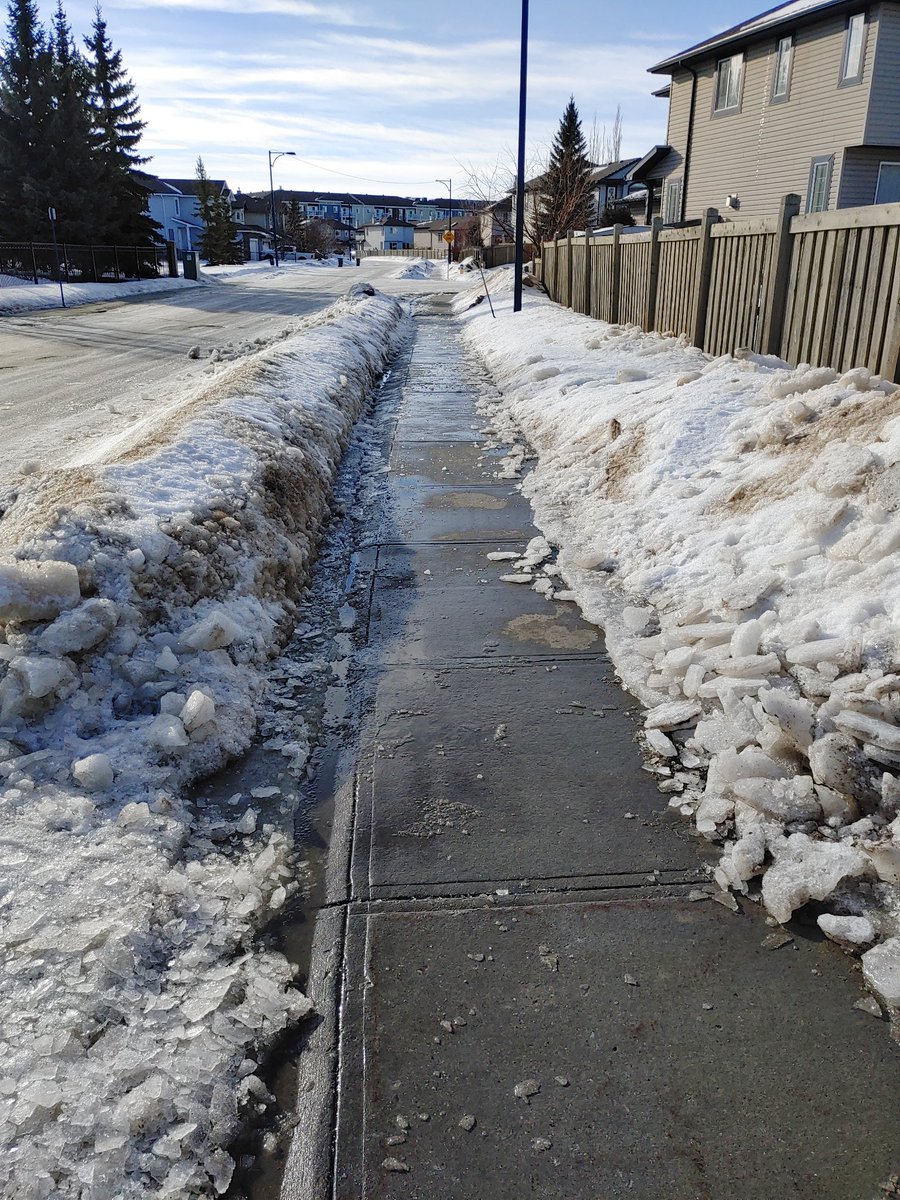 rawdneh's tweet photo. Dear @CityofEdmonton why do I pay taxes for you to block the gutter, creating a public safety hazard near a Canada Post mailbox. Notified 311, got "No action required" as response.

This is a failure of planning, execution and common sense. 

#yeg #yegcc https://t.co/VUNibvH8FI