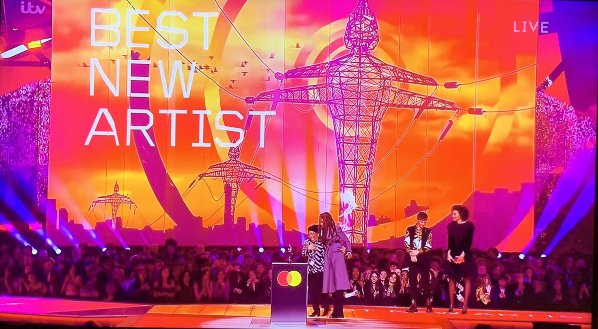 DionneGrant's tweet photo. “Look at what you done, mum”

Little Simz wins Best New Artist at the #BRITs, her first-ever award at the ceremony, and is joined by her mum on stage 🖤 https://t.co/yTBfysVVzl