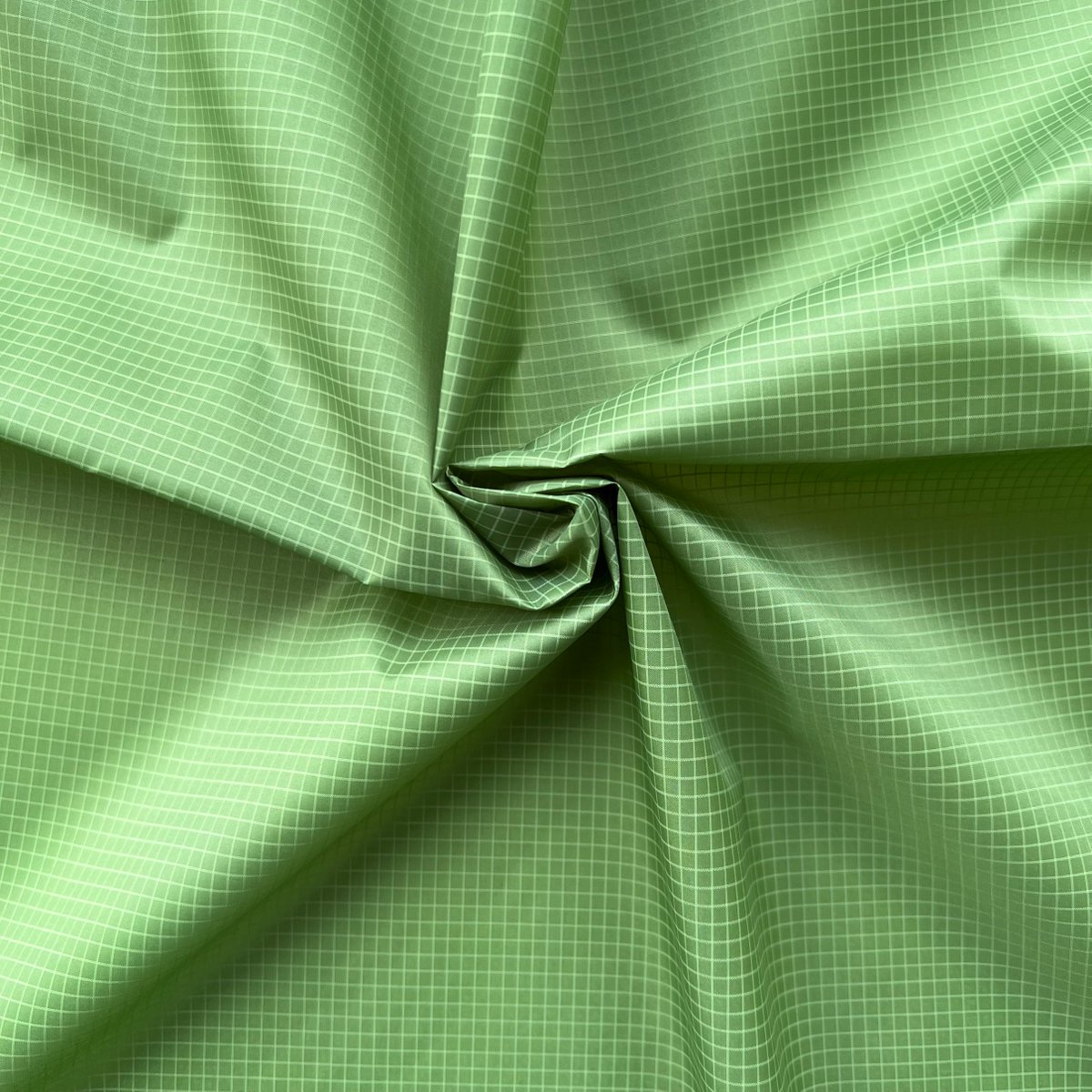 DITSTextile's tweet image. Polyester fabric with double-line ribstop with performances of #WaterRepellency, #WaterResistance, #DownProof, in color beginning-of-spring green. #SP2023
