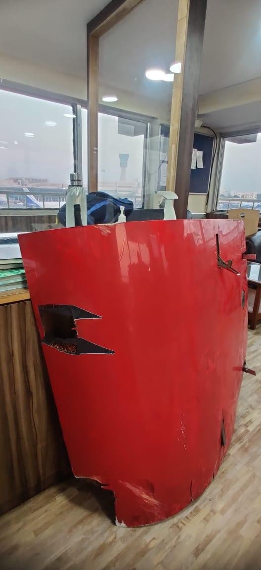 ANI's tweet photo. An Alliance Air ATR aircraft landed safely at Bhuj from Mumbai after a part of the engine cowling fell down during take-off this morning. The flight had taken off from Mumbai. Directorate General of Civil Aviation (DGCA) has initiated an inquiry. https://t.co/gEdH0nN5Dn