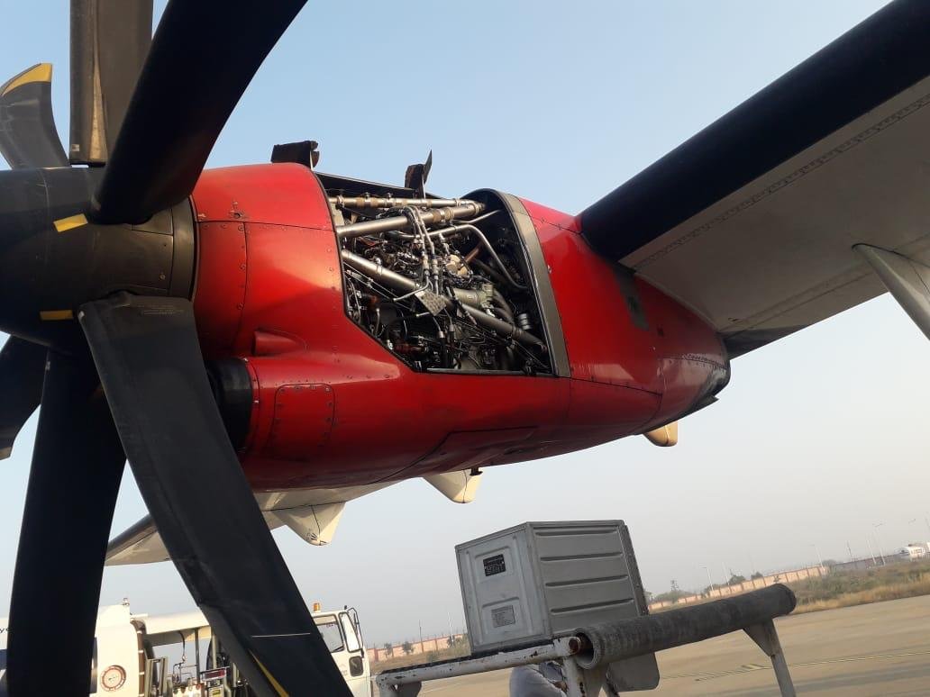 ANI's tweet photo. An Alliance Air ATR aircraft landed safely at Bhuj from Mumbai after a part of the engine cowling fell down during take-off this morning. The flight had taken off from Mumbai. Directorate General of Civil Aviation (DGCA) has initiated an inquiry. https://t.co/gEdH0nN5Dn
