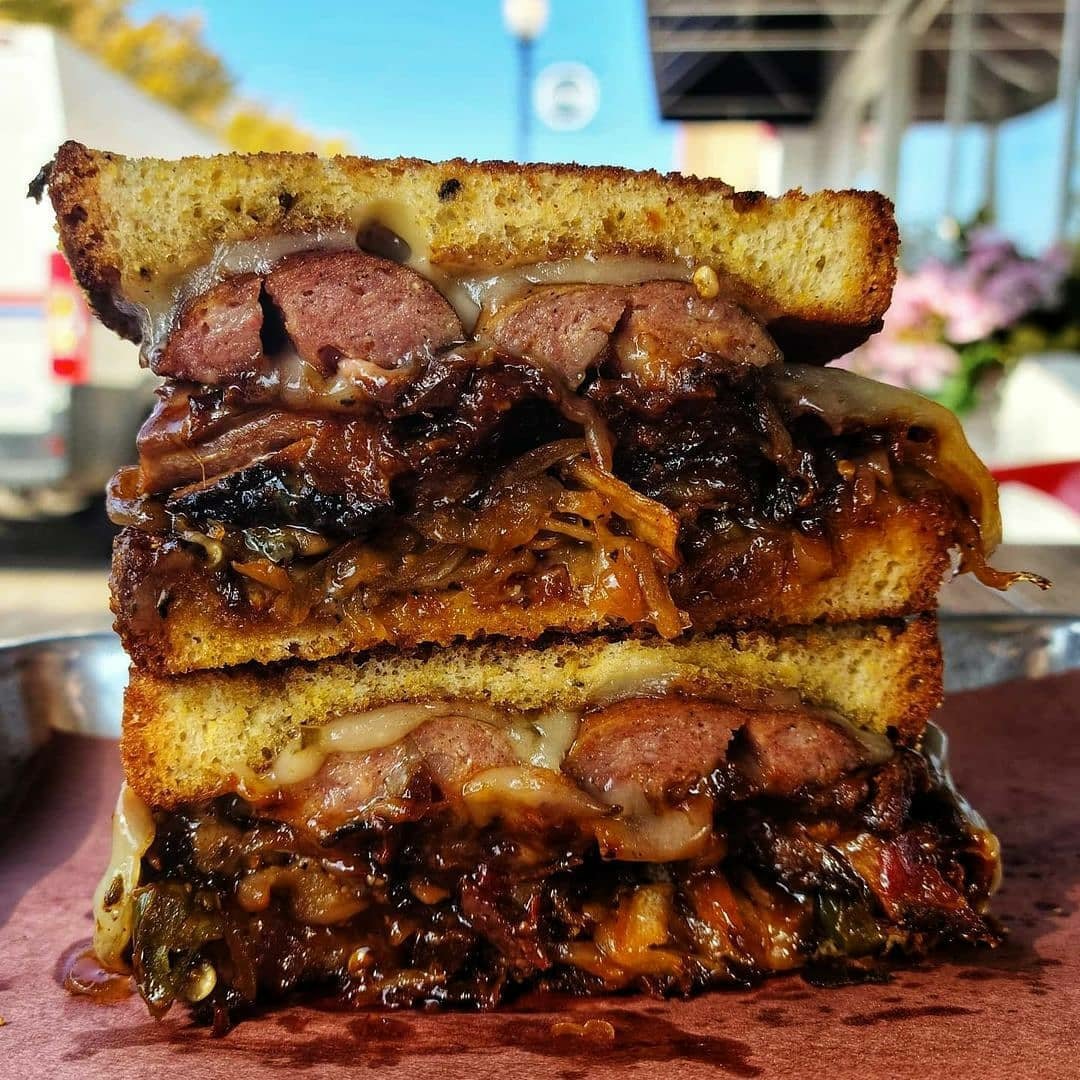 Today's beastwich is chopped brisket, black pepper beef sausage, Swiss cheese, and smoked onions and jalapenos on jalapeño bread!