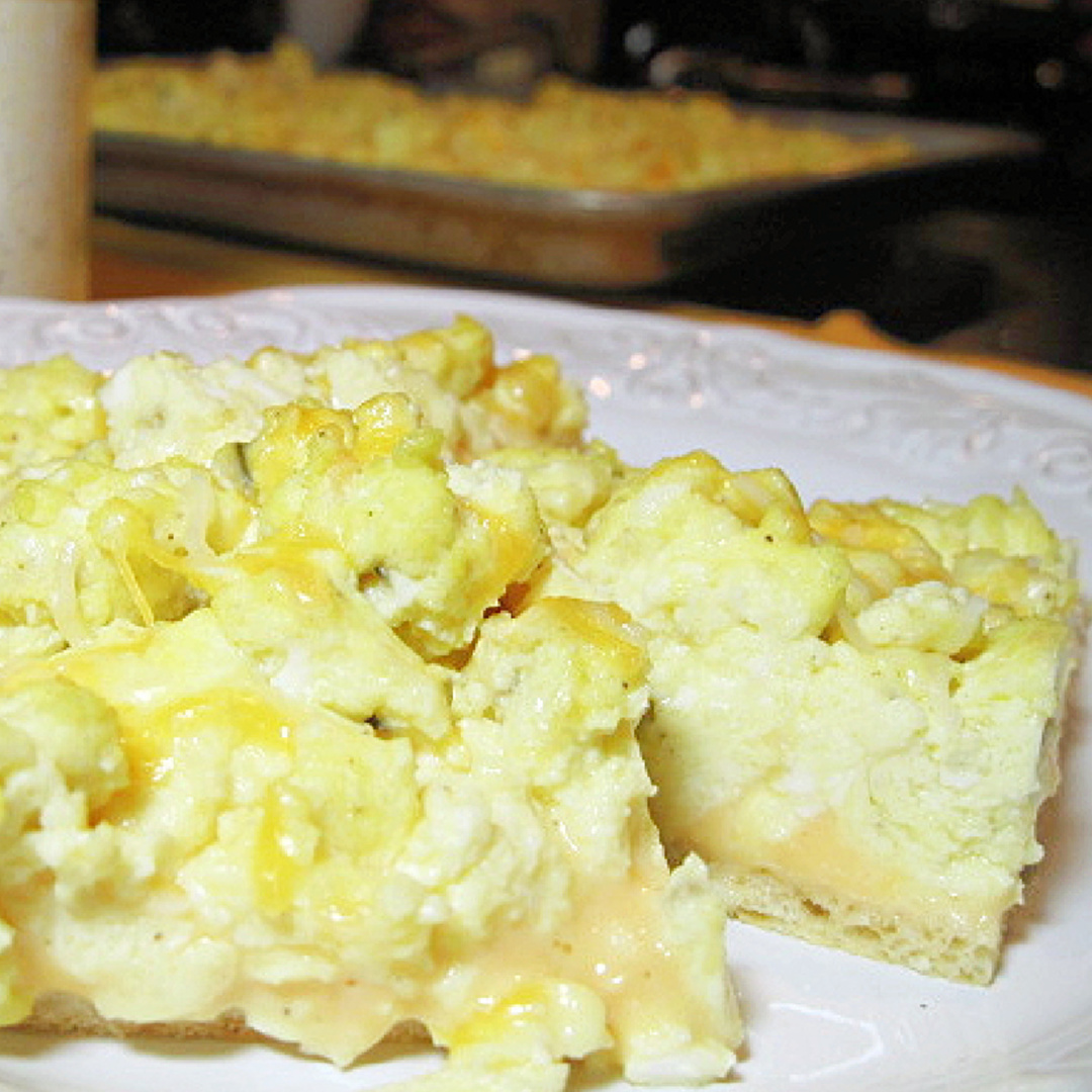 If you're a fan of scrambled eggs, then this easy breakfast pizza made with a crescent roll crust is something you're going to love!! It's perfect for breakfast, brunch, lunch, or dinner. #breakfast #brunch #eggs #breakfasttime kudoskitchenbyrenee.com/easy-breakfast…