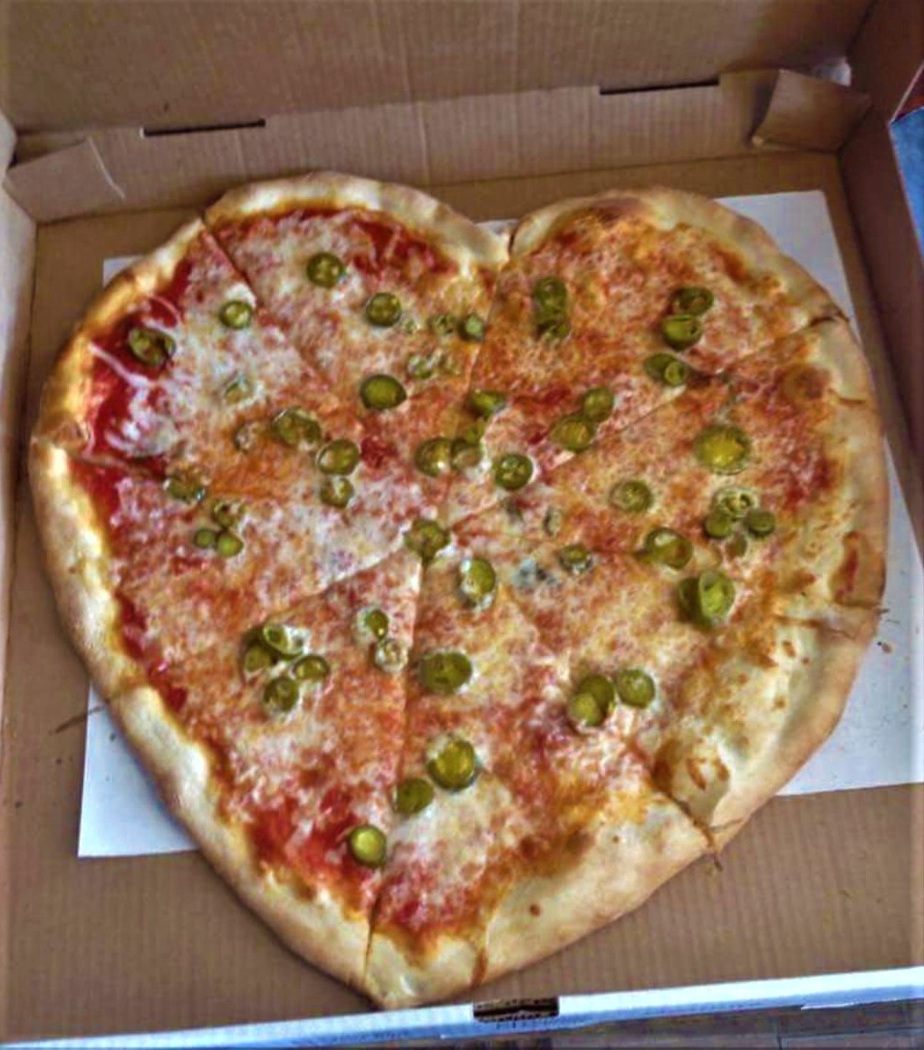 It's National Pizza Day! Celebrate with a slice from Louie's Cafe! 🍕