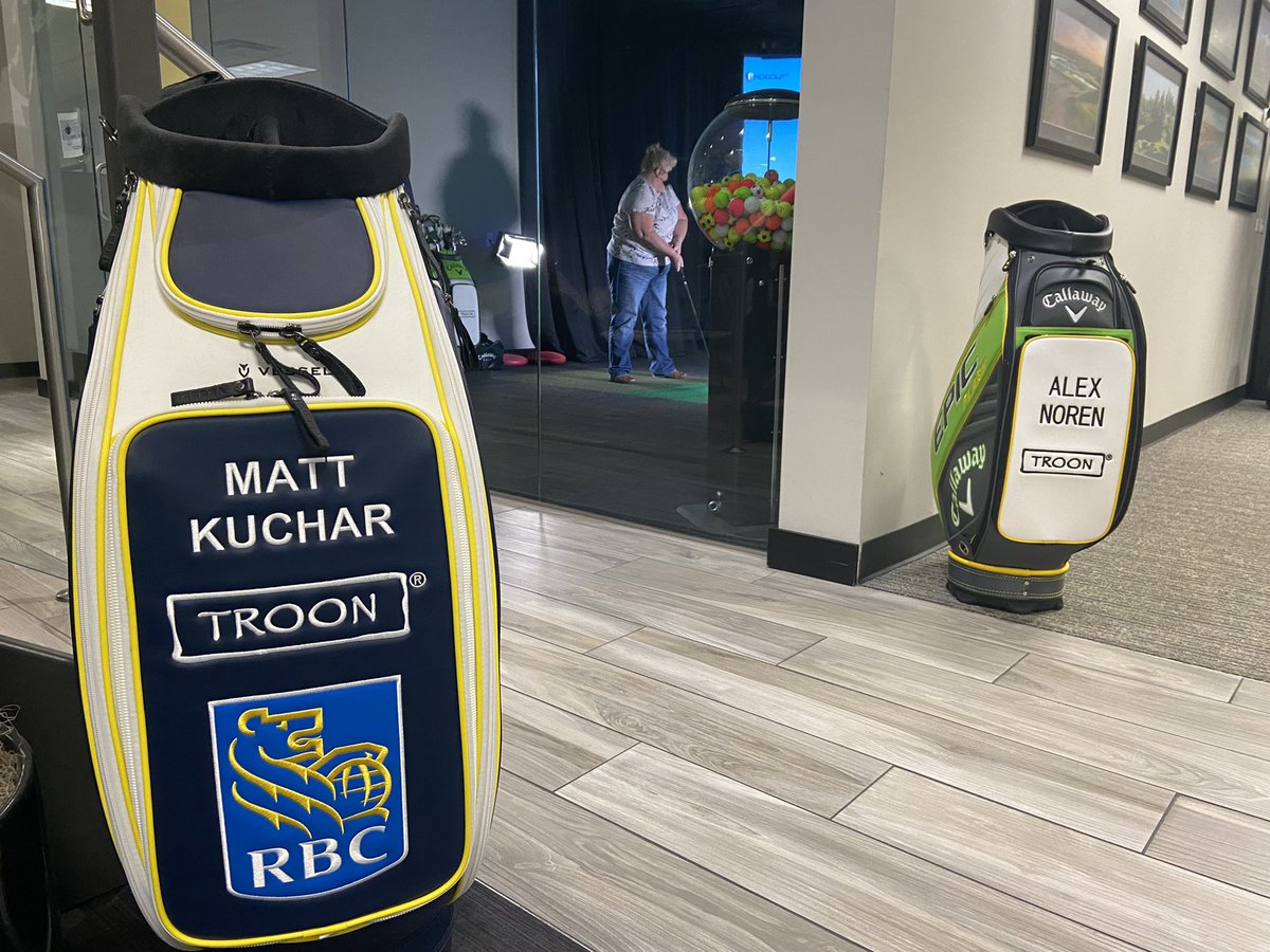 Troon's tweet image. Alex Noren and Matt Kuchar of #TeamTroon swung by the Troon Corporate Office in Scottsdale for a Closest to the Pin challenge against associates in the Golf Simulator! 

#ExperienceTroon
