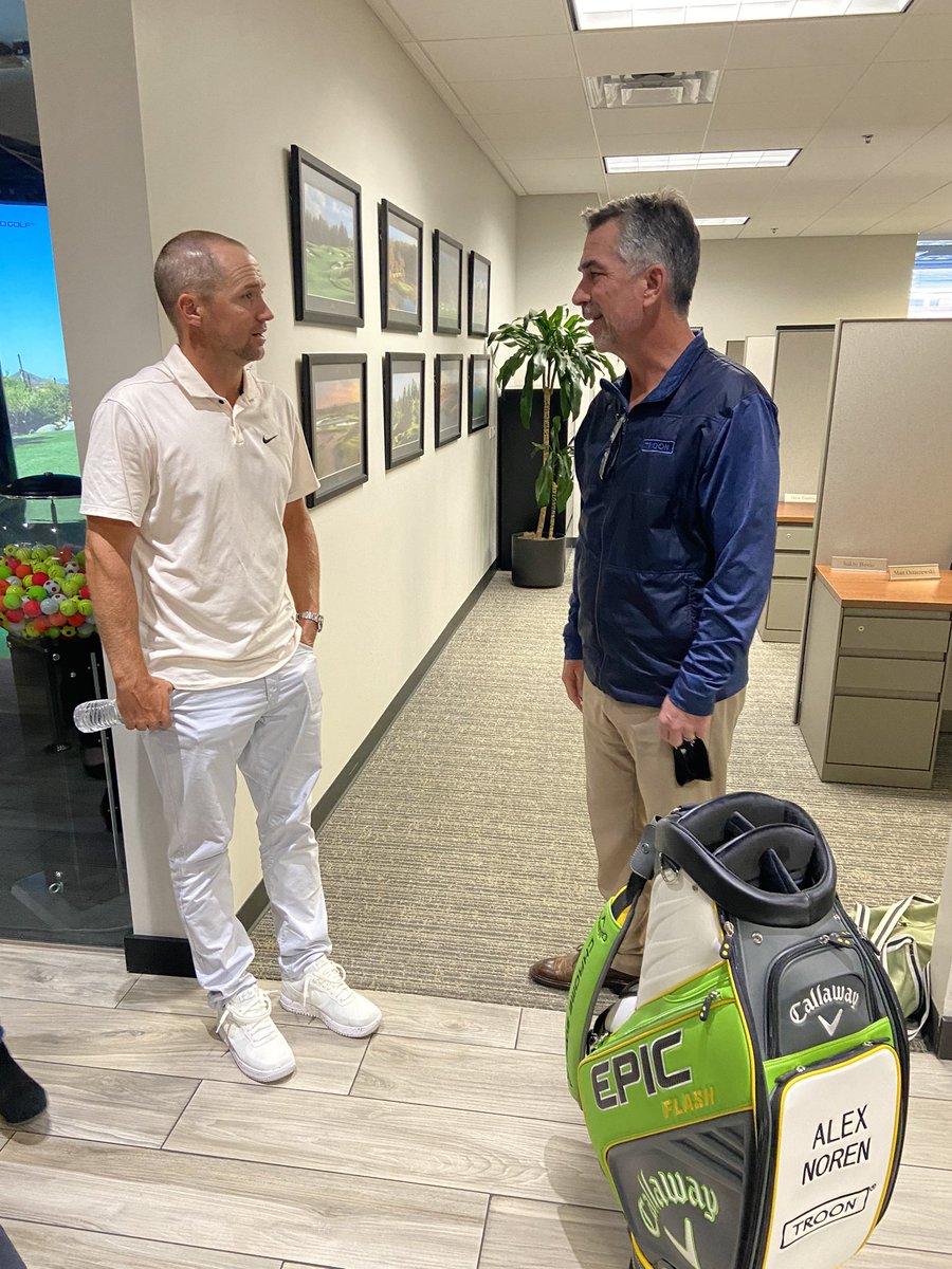 Troon's tweet image. Alex Noren and Matt Kuchar of #TeamTroon swung by the Troon Corporate Office in Scottsdale for a Closest to the Pin challenge against associates in the Golf Simulator! 

#ExperienceTroon