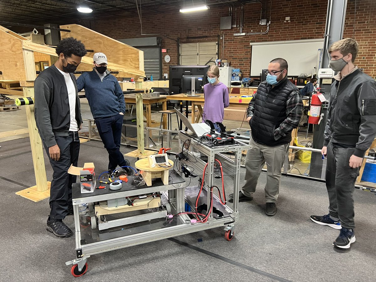 bart_carlson's tweet photo. We are looking good. Our elevator is coming together James and Conor,Devon under the watchful eyes of Mr Korey Gaddy and Ms. Ginina. Rishi on the CNC cutting out the shooter to be built on Thursday night meet. Fredrick and Apple and Nolan are programming the lime light. https://t.co/kO3G4oomE9
