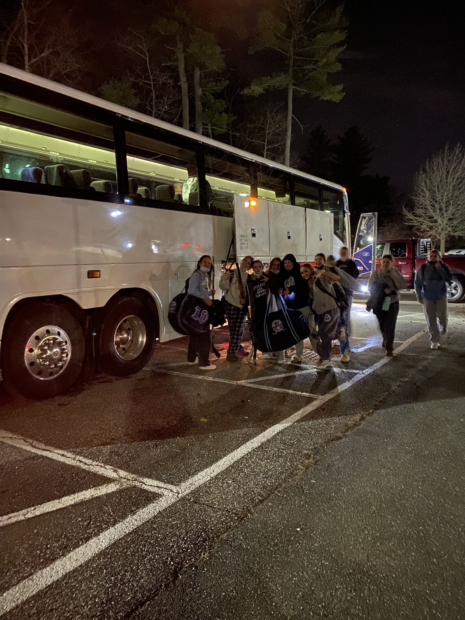 girls hockey team boarding bus after game at Longmeadow