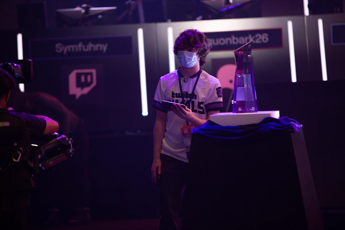 Tubbo wearing a Twitch RIvals jersey while walking with a mobile streaming setup from Samsung on the Twitch Rivals Stage!