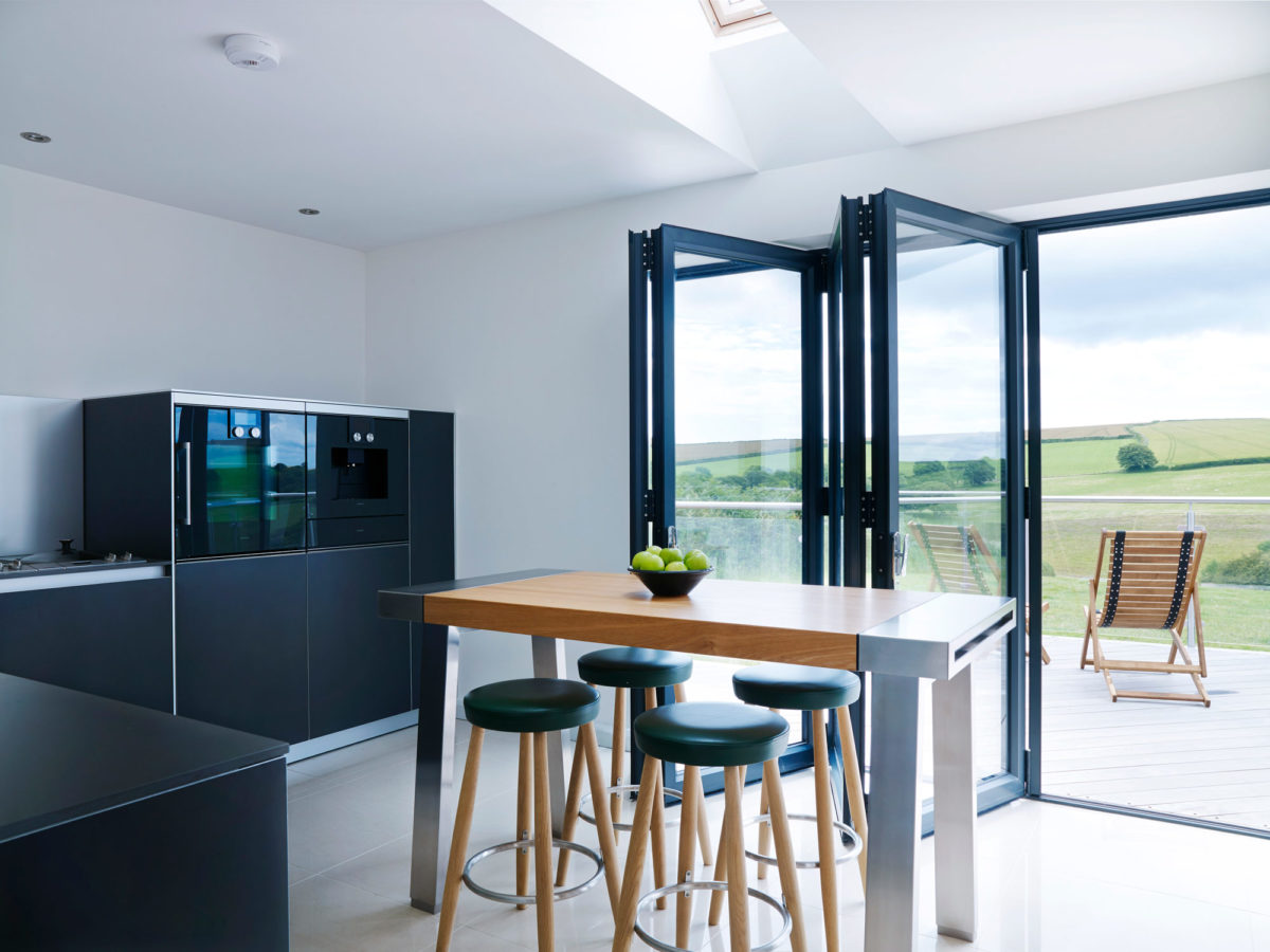 Countryside views take centre stage in this stunning farmhouse #bulthaup kitchen where industrial finishes provide a nod to the building’s agricultural roots. Inspired? See more projects here ow.ly/Eq9350HRtaQ