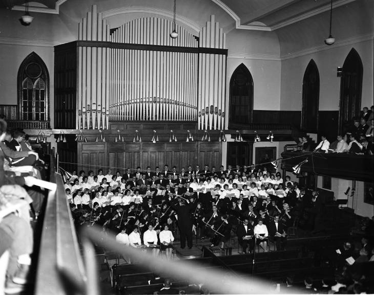 A large choir and orchestra concert in Meharry Hall. How many musicians can you count? #ThrowbackThursday