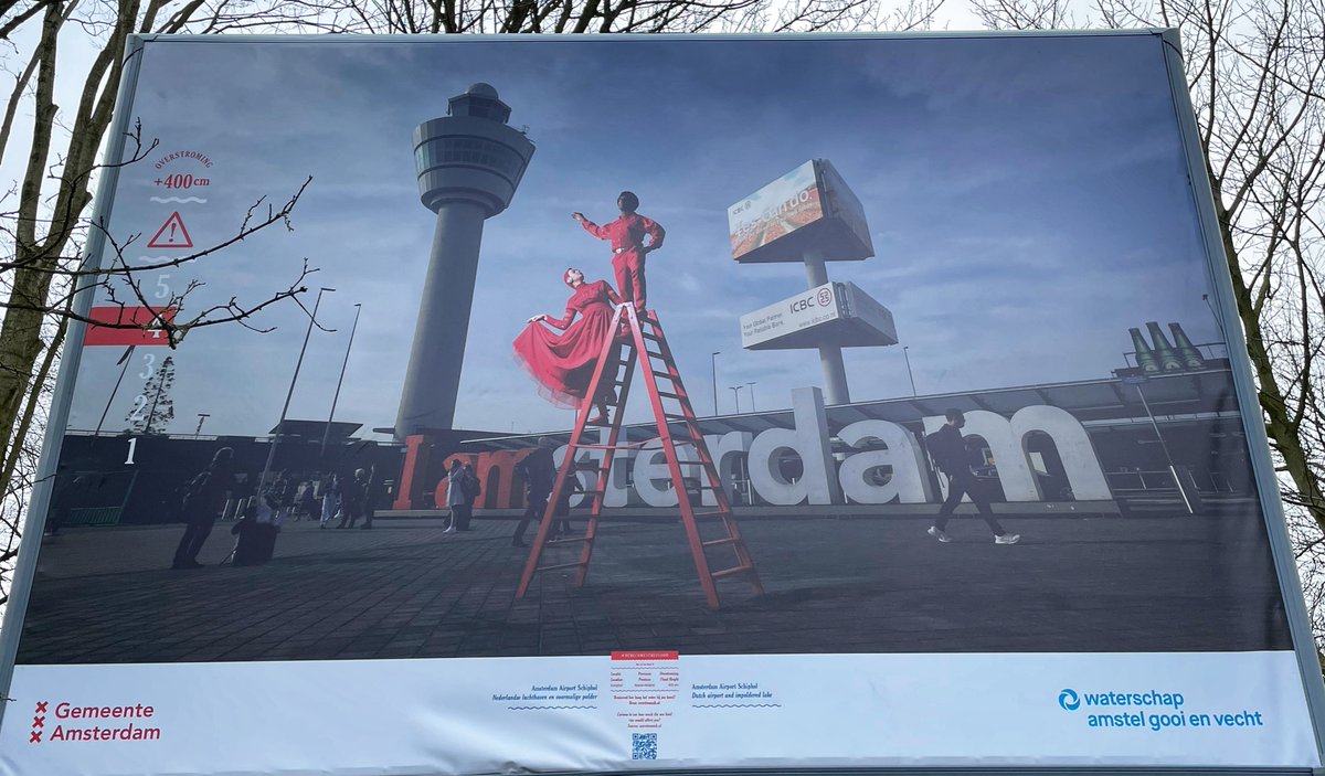 danieljobrown's tweet photo. Beautiful exhibition going on in Amsterdam Oosterpark presently - billboards using models on red ladders to highlight where the water would be up to if the dykes burst, showcasing risks of climate change. #herecomestheflood https://t.co/aC3PDnOjC8