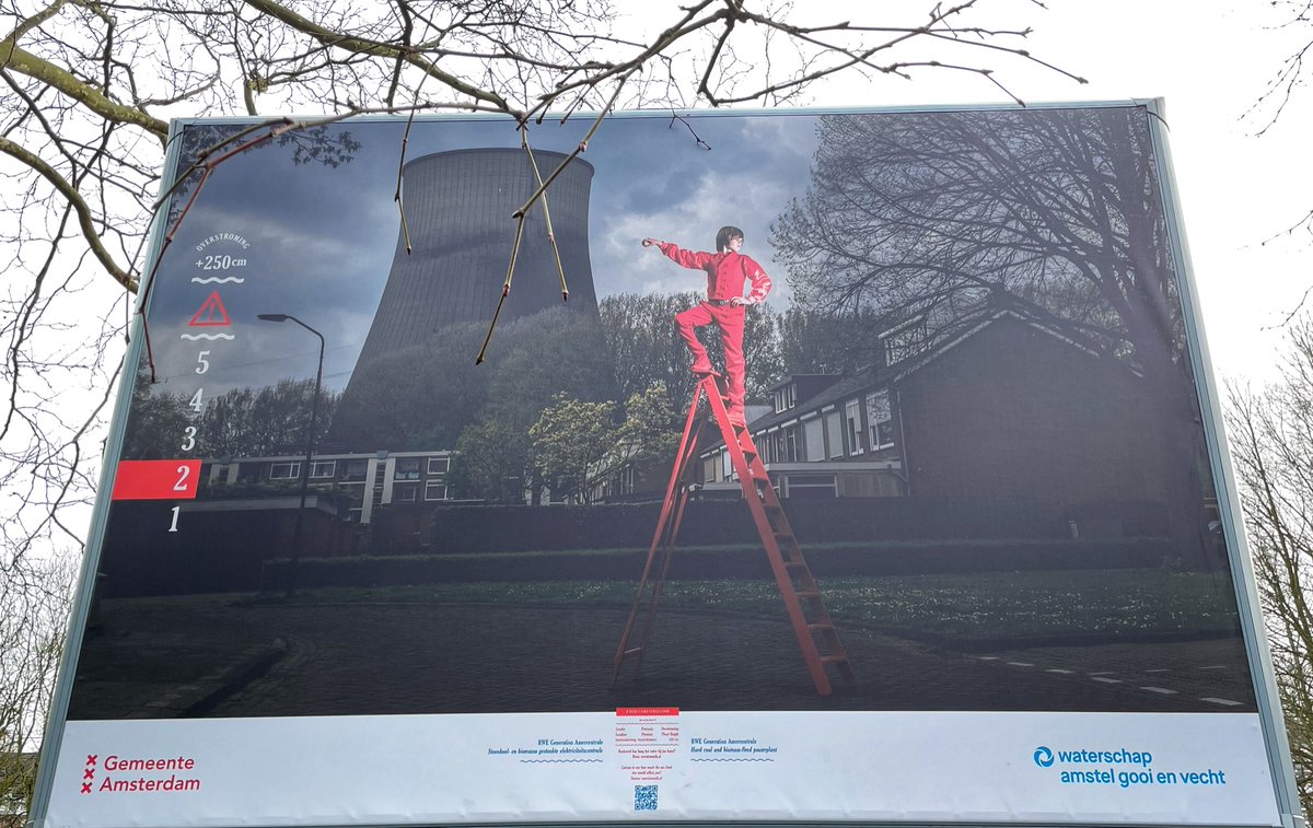 danieljobrown's tweet photo. Beautiful exhibition going on in Amsterdam Oosterpark presently - billboards using models on red ladders to highlight where the water would be up to if the dykes burst, showcasing risks of climate change. #herecomestheflood https://t.co/aC3PDnOjC8