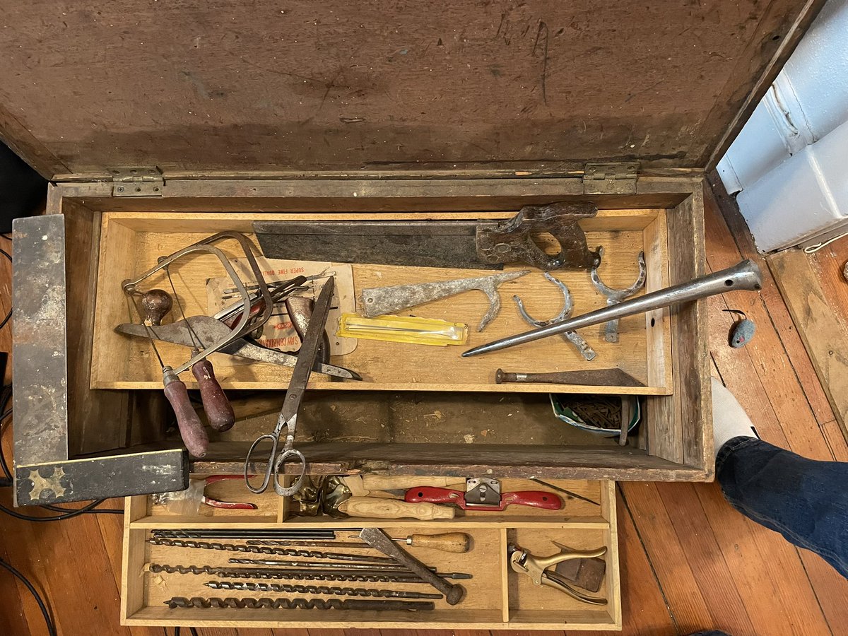 willtraves1's tweet photo. A 100 year old chest of tools and hardware that has found a new home in my little apartment. I’m particularly pleased with adzes, caulking irons, and marlinspike. The previous owner, a retired shipwright, was happy they were going to a good home. https://t.co/uMNPG3tKEw