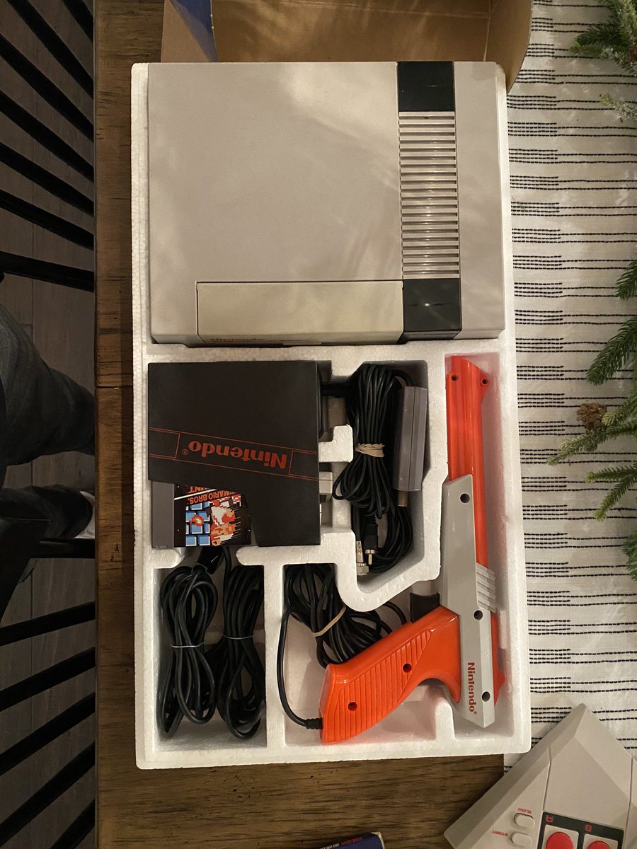 HarrisLue's tweet photo. Also reunited it with the original accessories and original box that my parents have had in their closet for longer than I’ve been alive! Still has the Nintendo Power pamphlet and Poster in tact! #Nintendo #ActionSet #NintendoPower https://t.co/zJm8ll1W8s